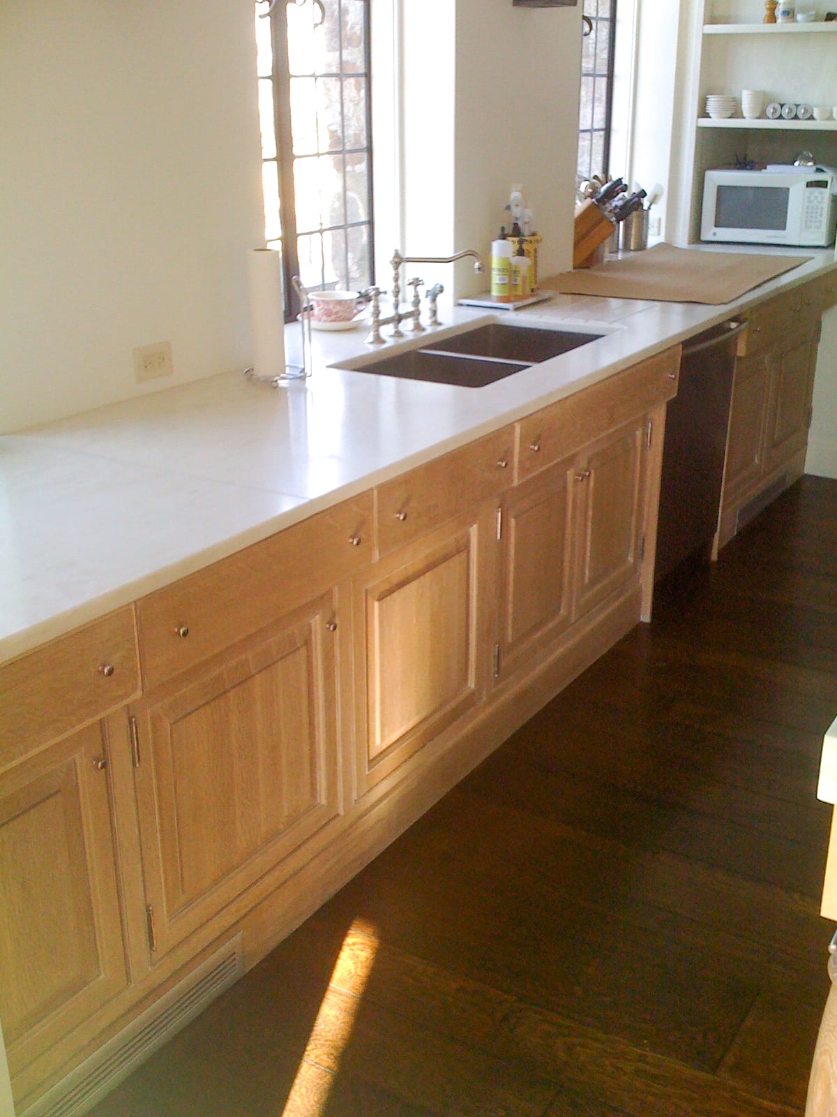 Wood Cabinets with White Marble Countertops