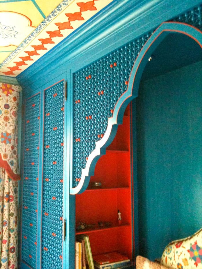 Teal Cabinetry with built in Red Shelves