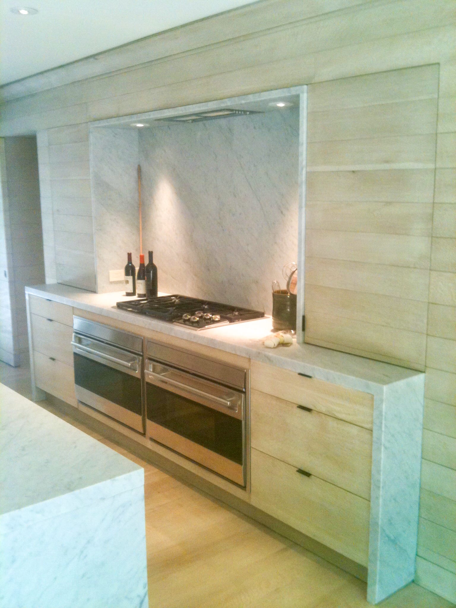 Paneled Light Wood kitchen with grey marble accents