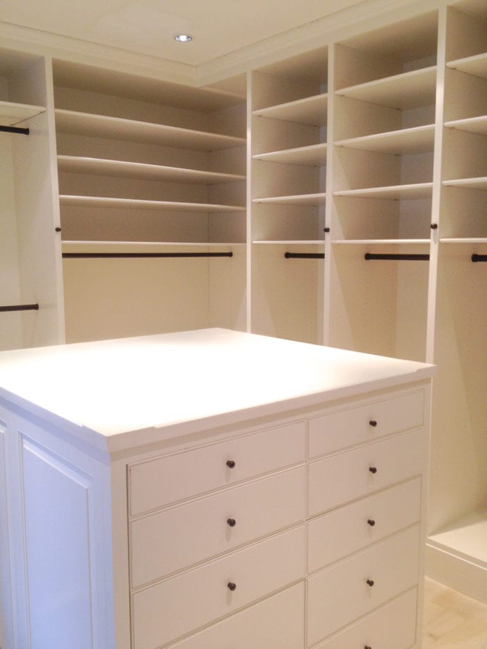 White Wooden Walk in Closet with built in shelves