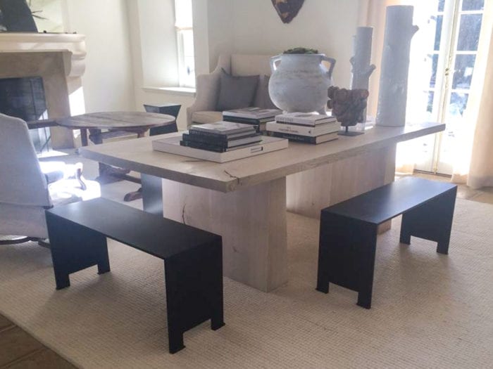 Textured wood dining table with black benches