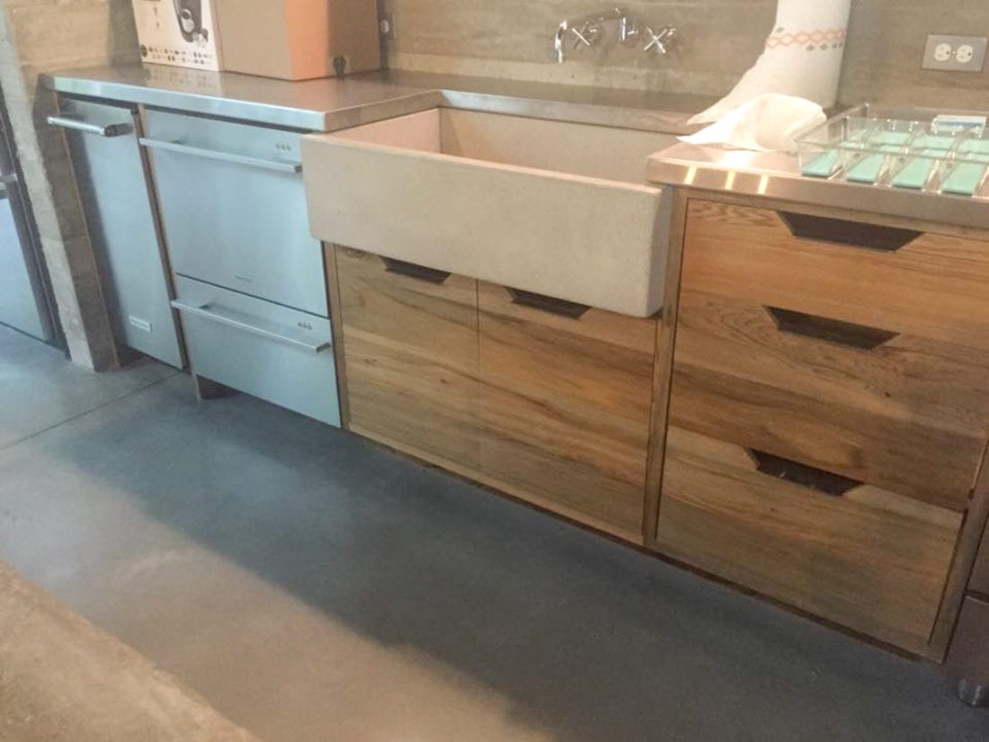Wood Kitchen with Stone Sink and Stainless Steel Appliances