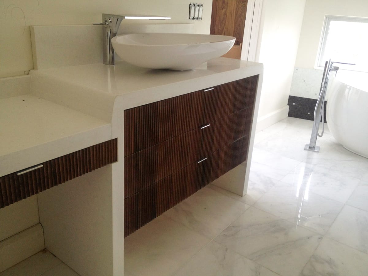 Fluted Walnut Vanity with white counters