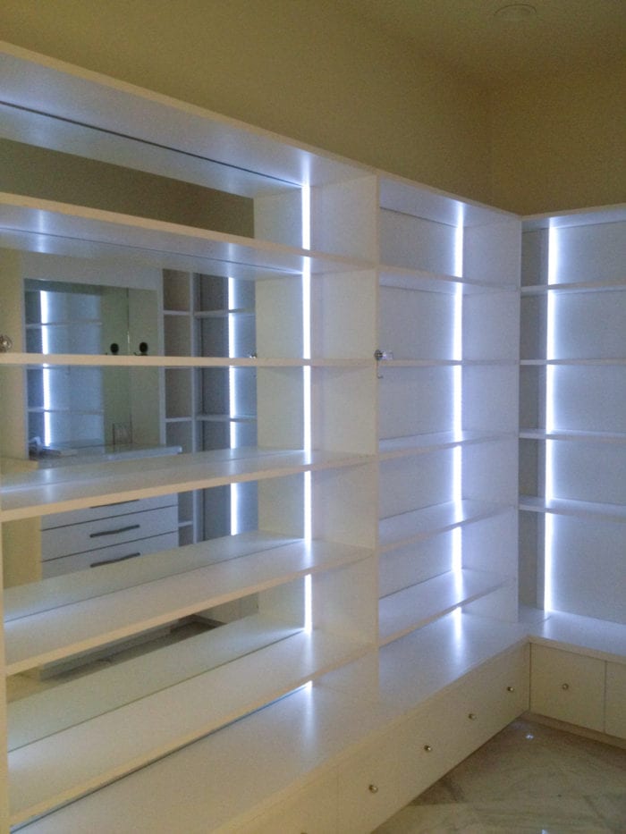 Sleek White Closet with Wall to Wall Shelves