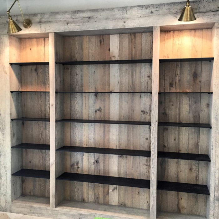 Wood Paneled Bookcase with Black Shelves