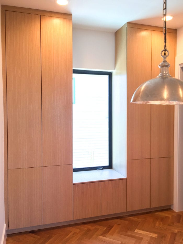 Sleek Floor to ceiling wood cabinetry