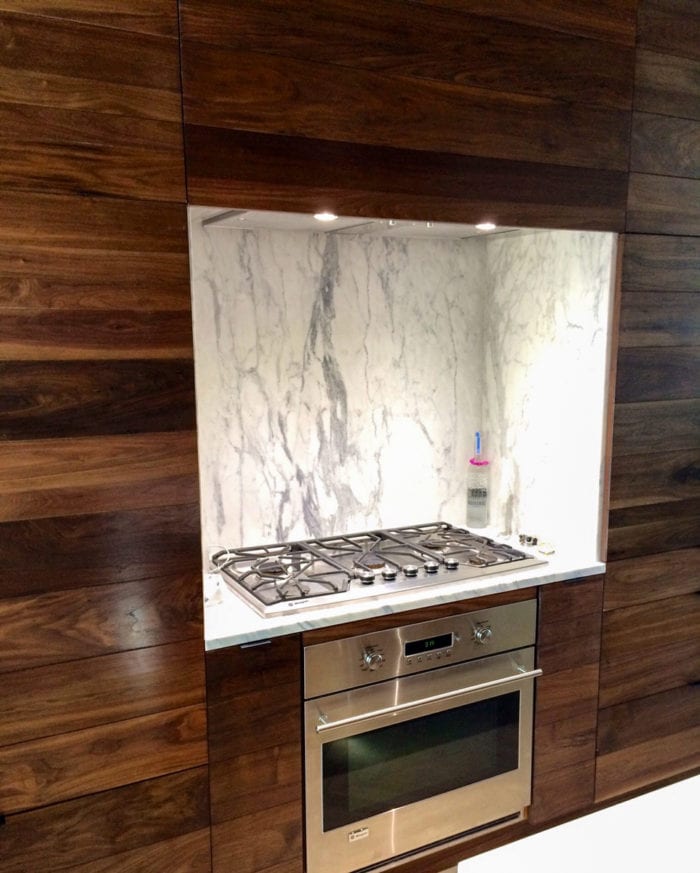 Walnut Kitchen with White Marble Backsplash