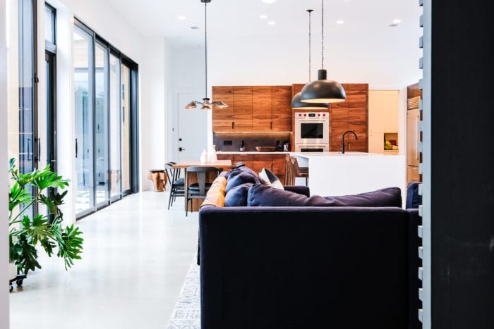 Black, White, and Walnut Kitchen from living room view