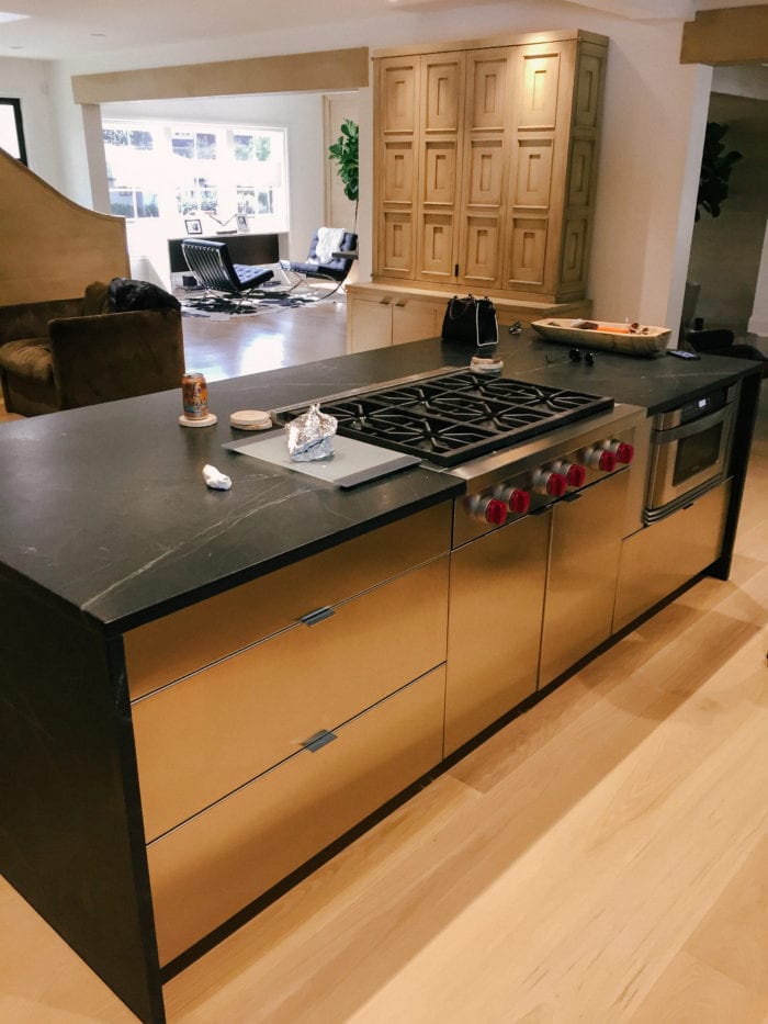 Stainless Steel Kitchen with Black Marble Countertops