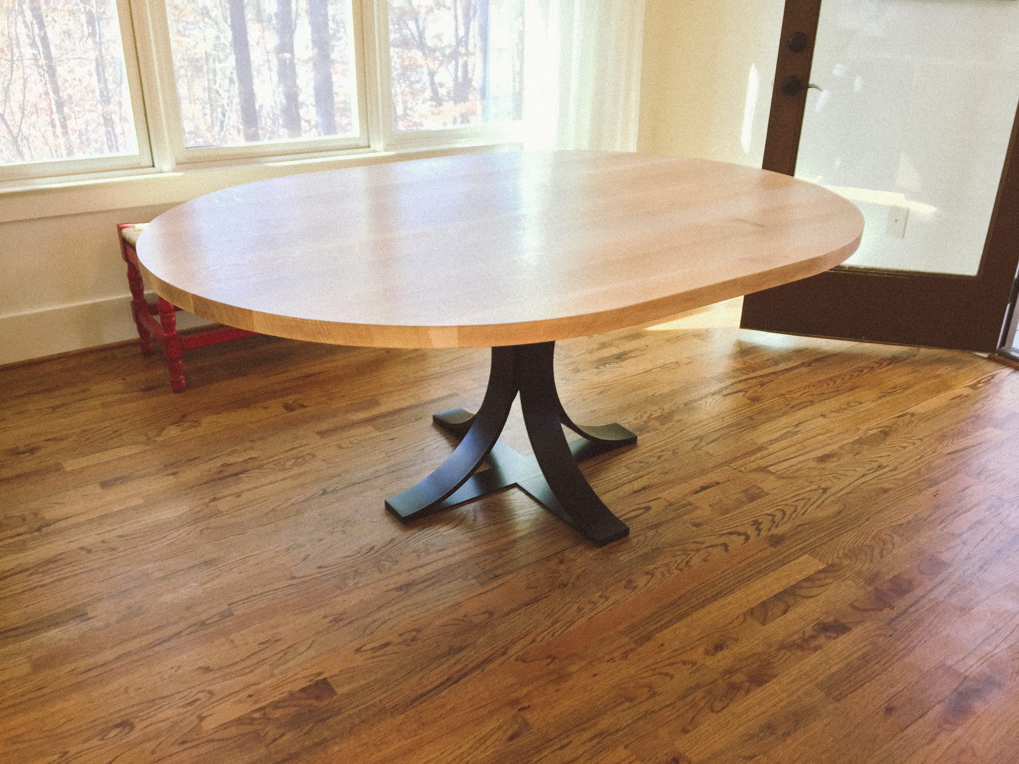 Quartersawn white oak and curved steel table side view
