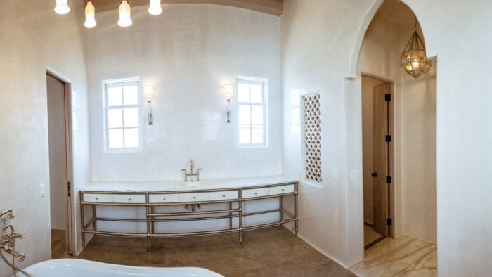White vanity with metal rod detailing