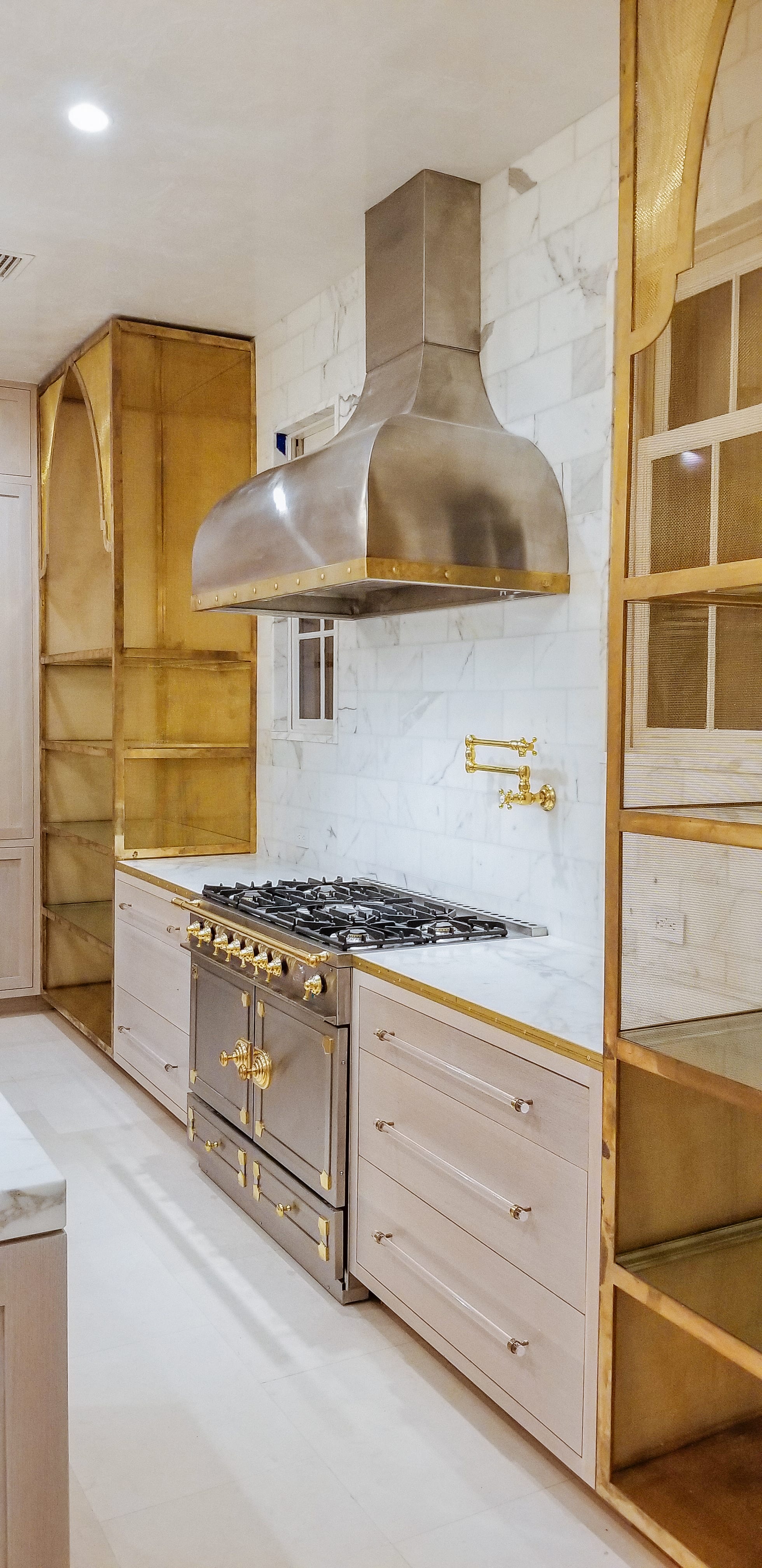 Oak and Brass Kitchen with Stainless Steel Stove