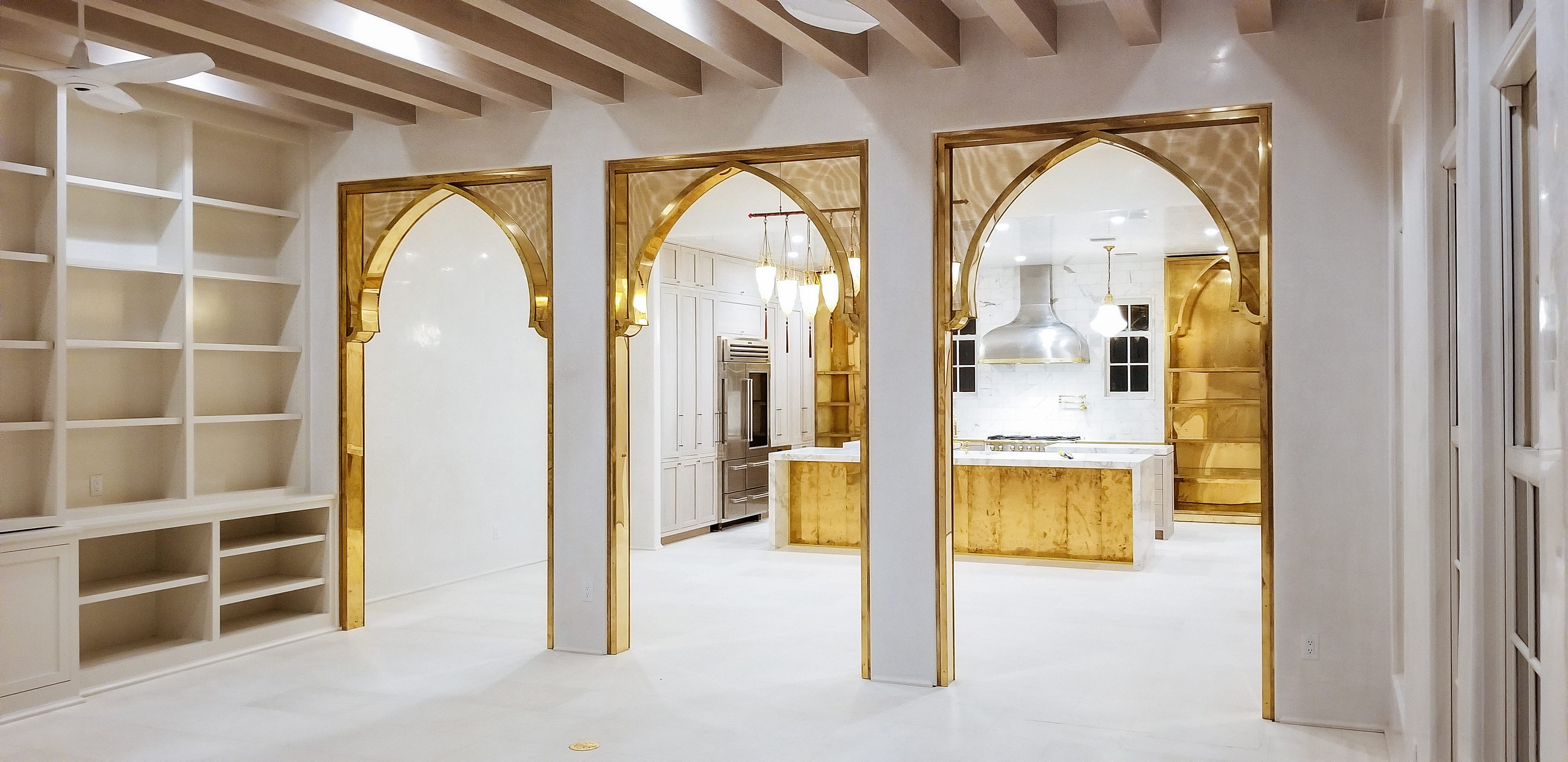 Oak and Brass Kitchen with Gold Arch Entryway