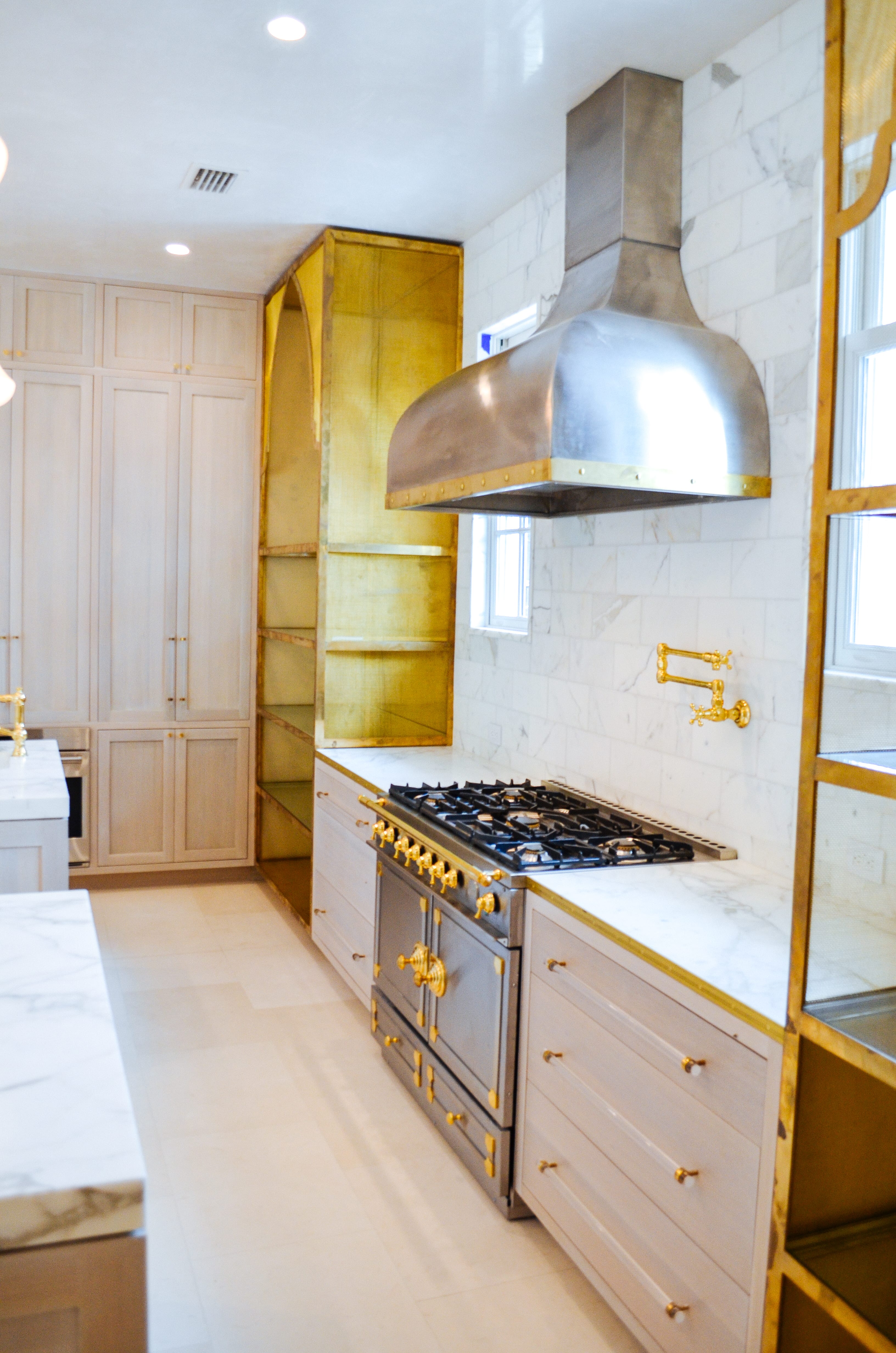 Oak and Brass Kitchen with Stainless Steel Stove