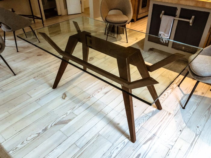 leggy walnut, brass, and glass breakfast table top view