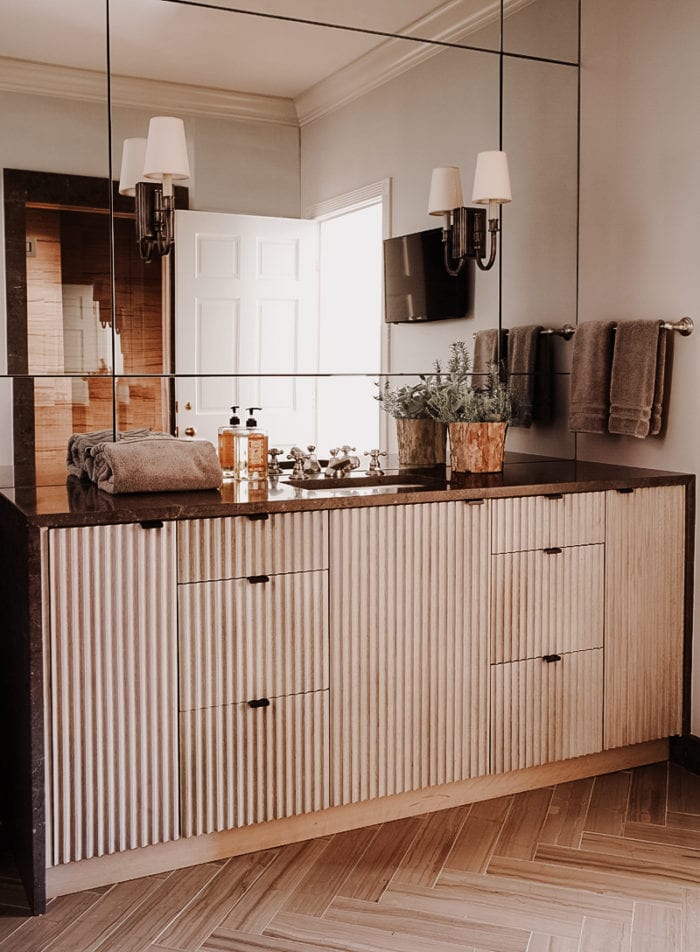 Fluted Vanity with brown marble countertop