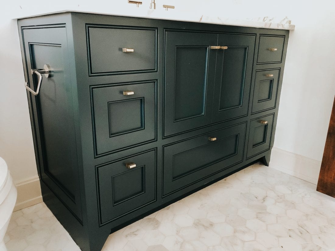 Simple Bathroom Vanity with black cabinets and marble top