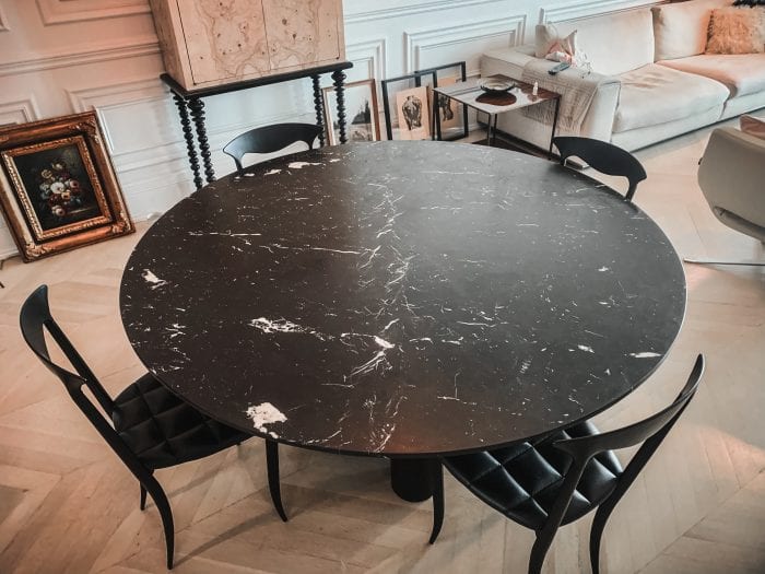 Marble and wood dining table with chairs from top