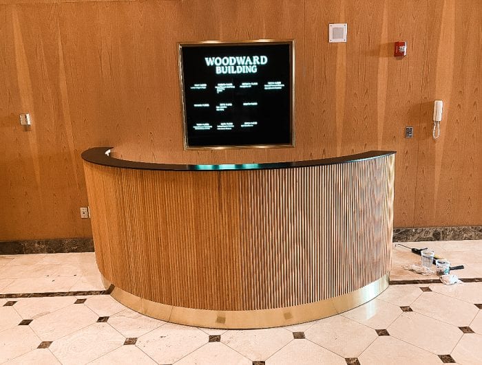 Fluted Reception Desk with Glossy Black Top and Brass Base