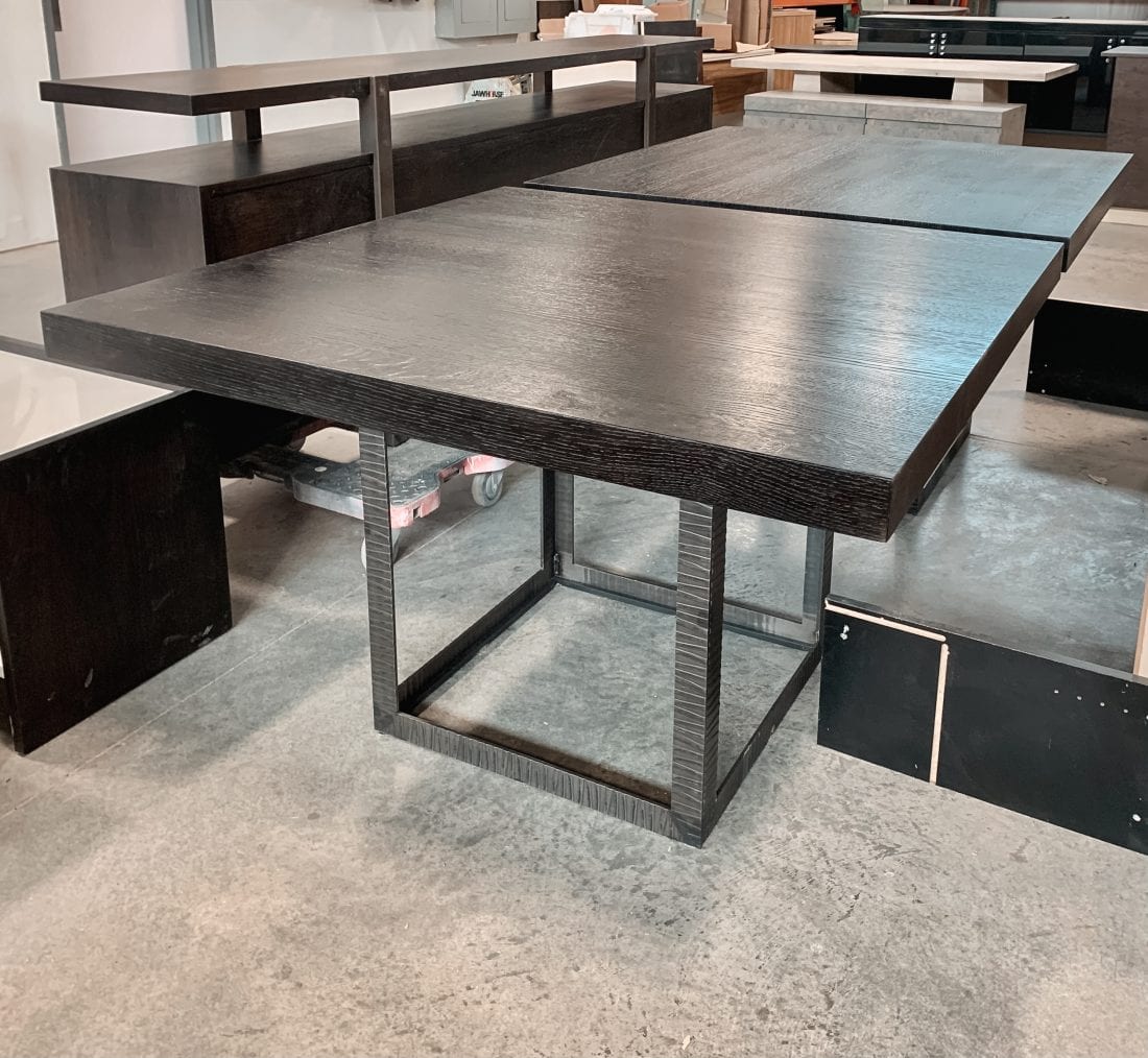 Textured, ebonized oak and iron tables