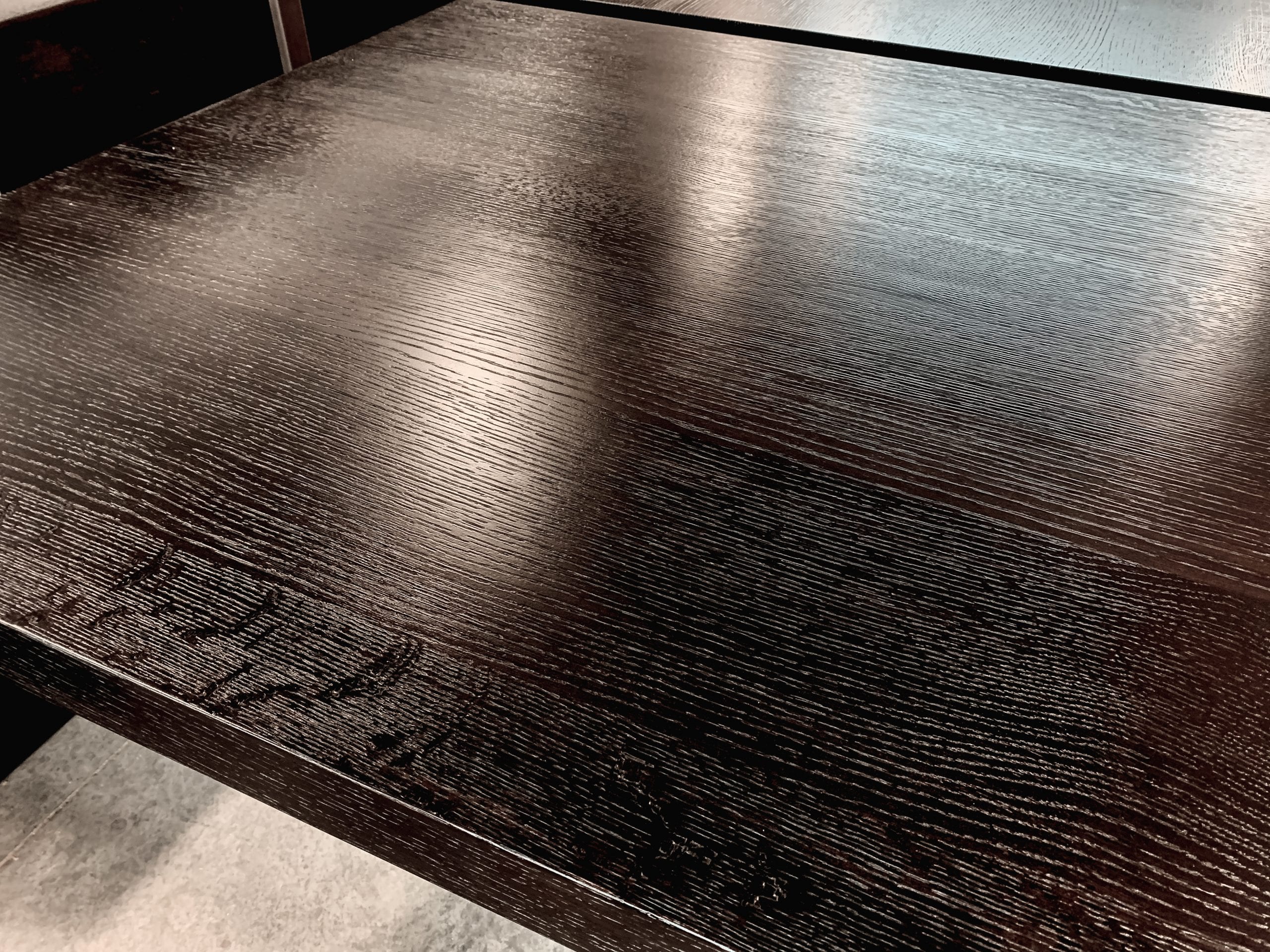 Textured, ebonized oak and iron table details