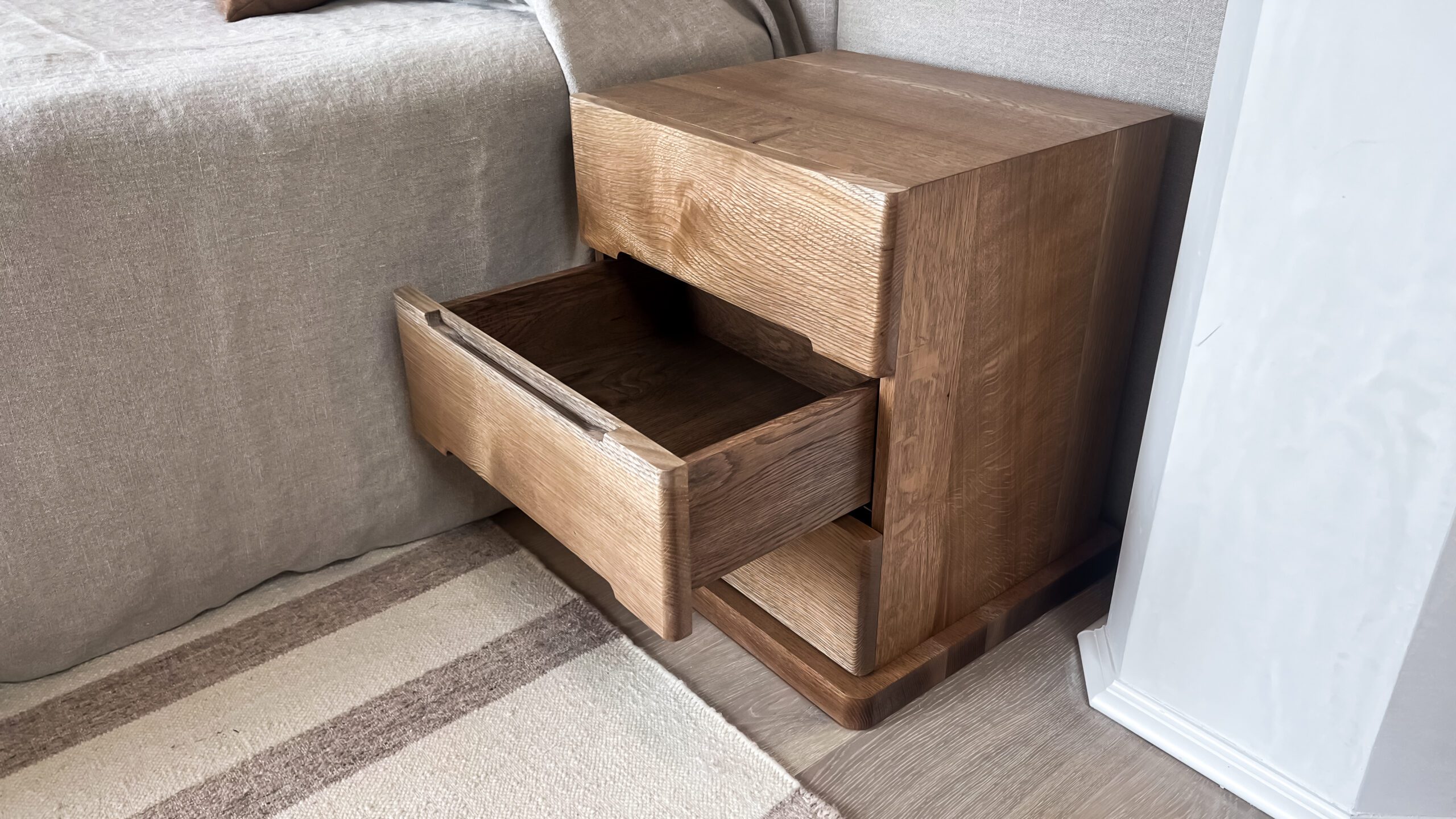 Opened Bedside Table with Integrated Pulls on Drawers
