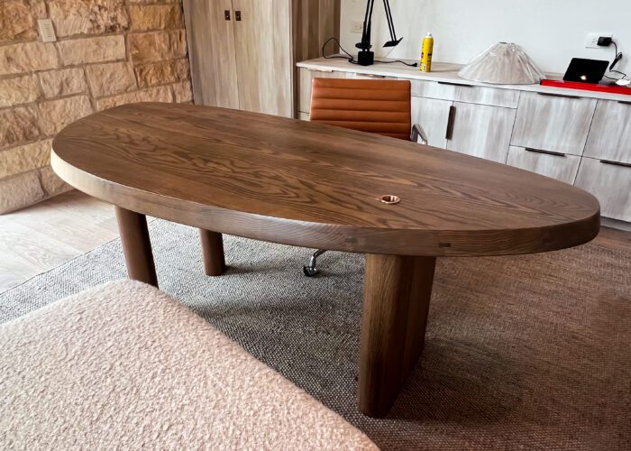 Asymmetrical office desk with brass inlay