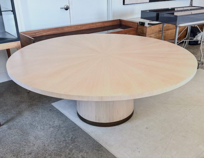 Radiate Table with brass base made by facet furniture