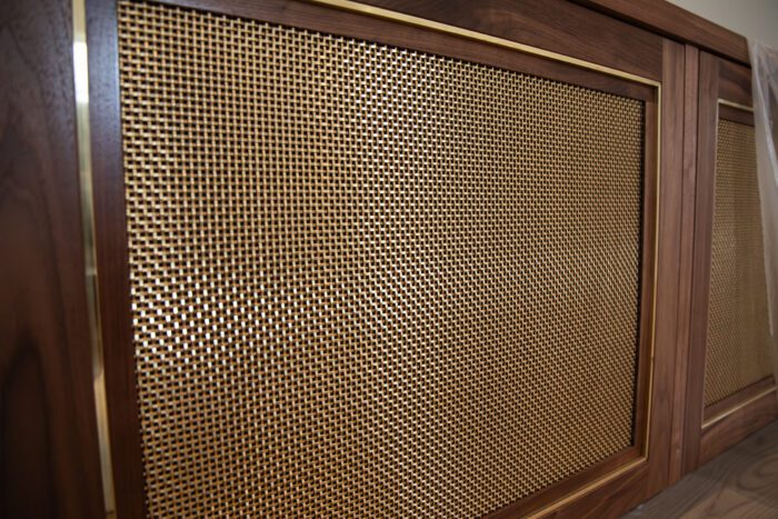 Checkout the details on this custom designed cabinet door for an entertainment console we just installed! We love brass, especially when paired with a rich walnut finish.⁠