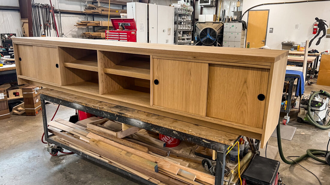 Credenza for Media Room with sliding cabinets and shelving