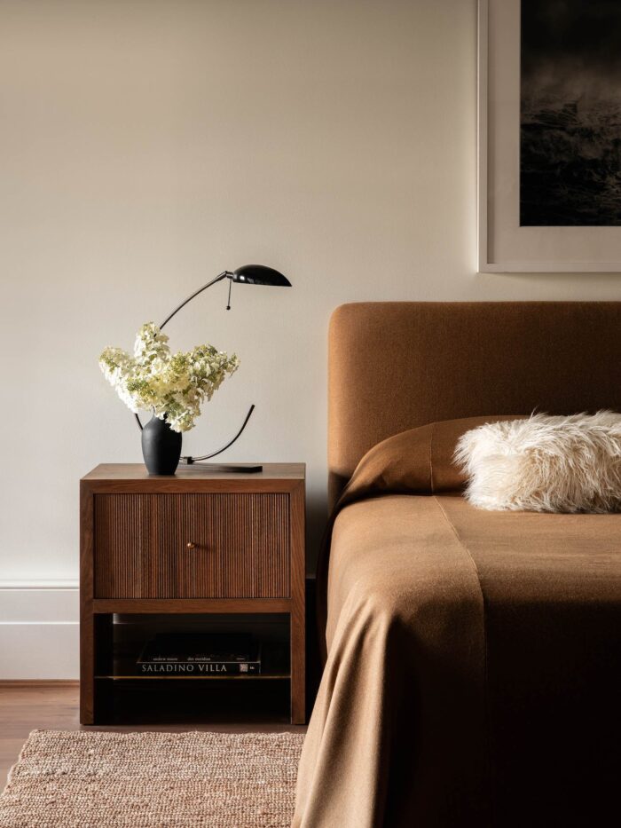 Reeded side table in bedroom by mdm design studio