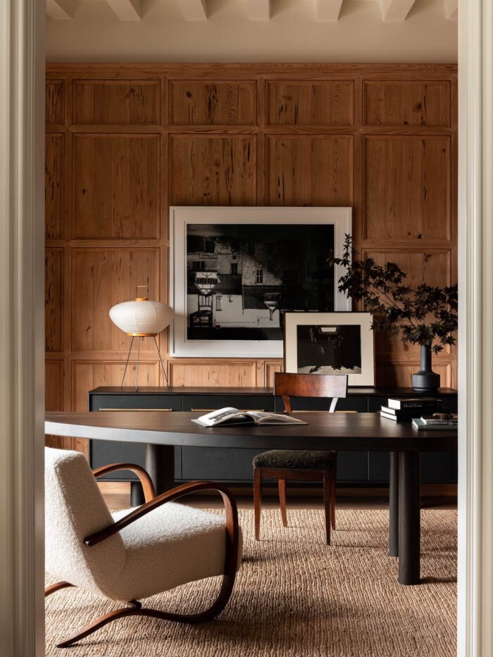 leather credenza and walnut desk in office