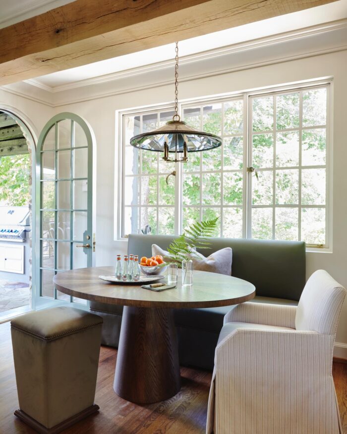 A Radiate Table from our furniture line in a beautiful, naturally lit breakfast nook.⁠