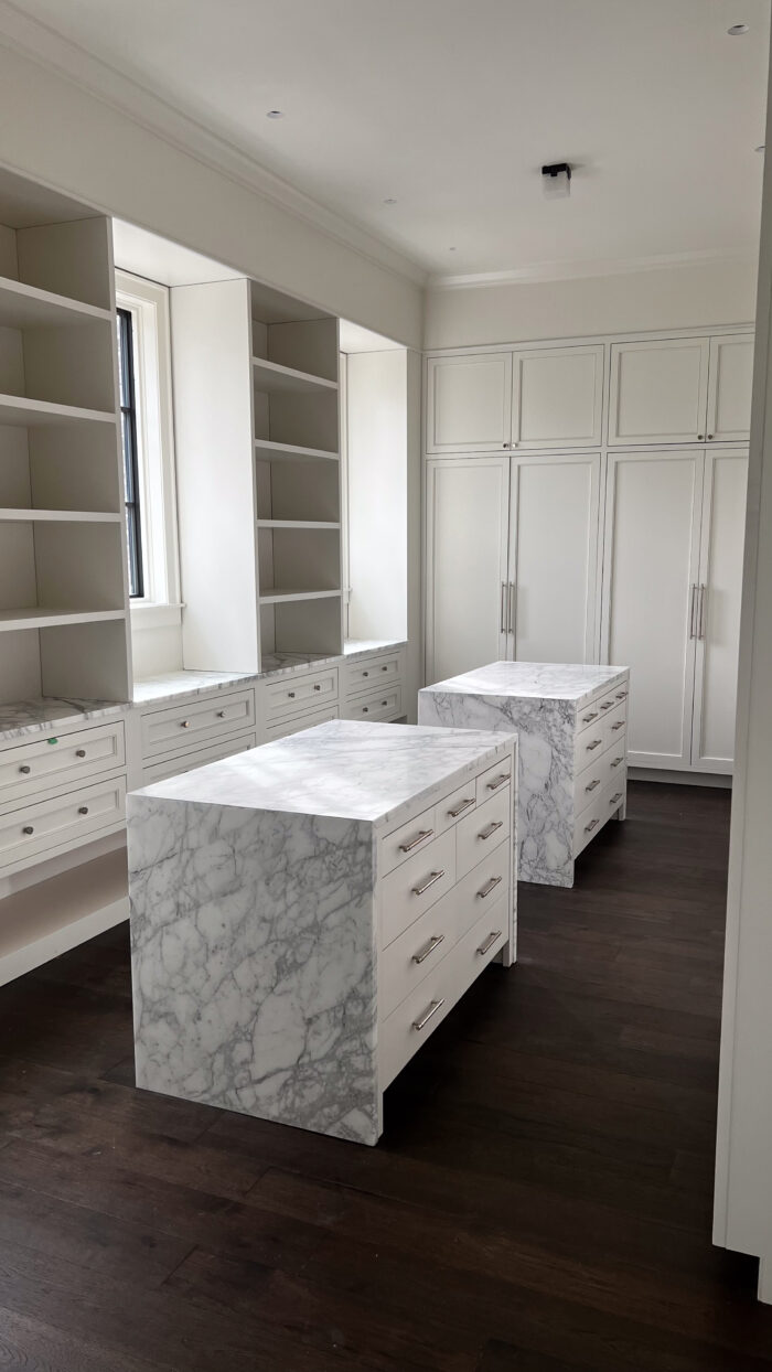 Dream Walk In Closet with Marble Islands
