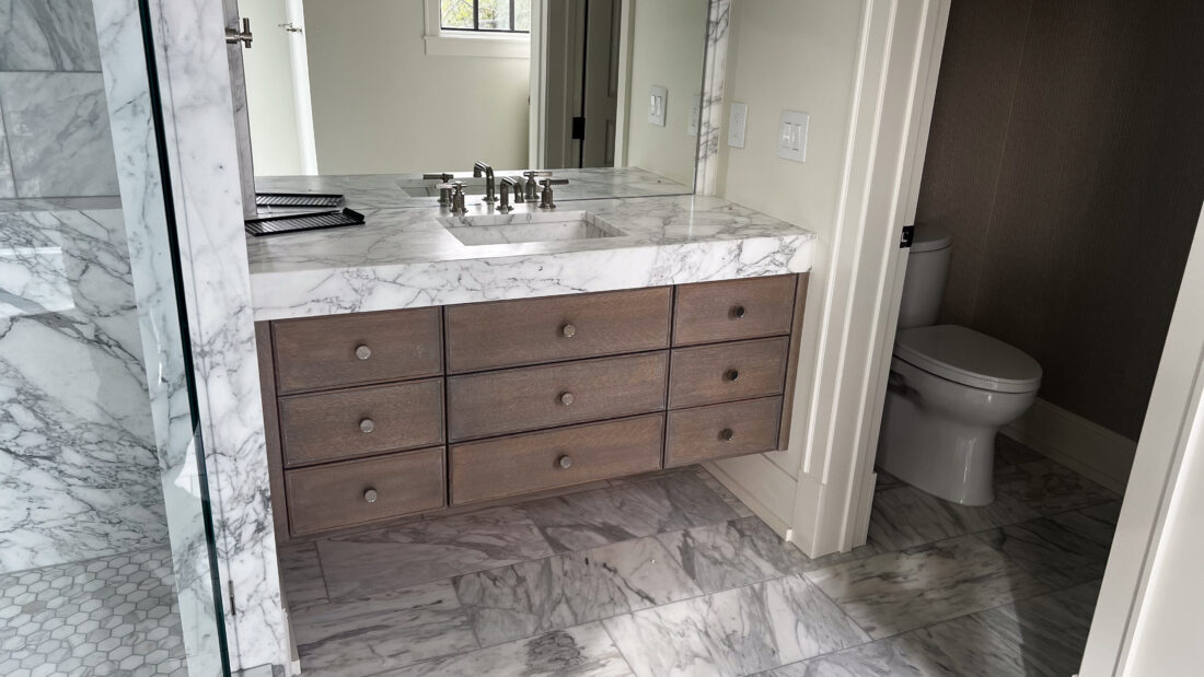 Floating Walnut Vanity with Marble Countertops