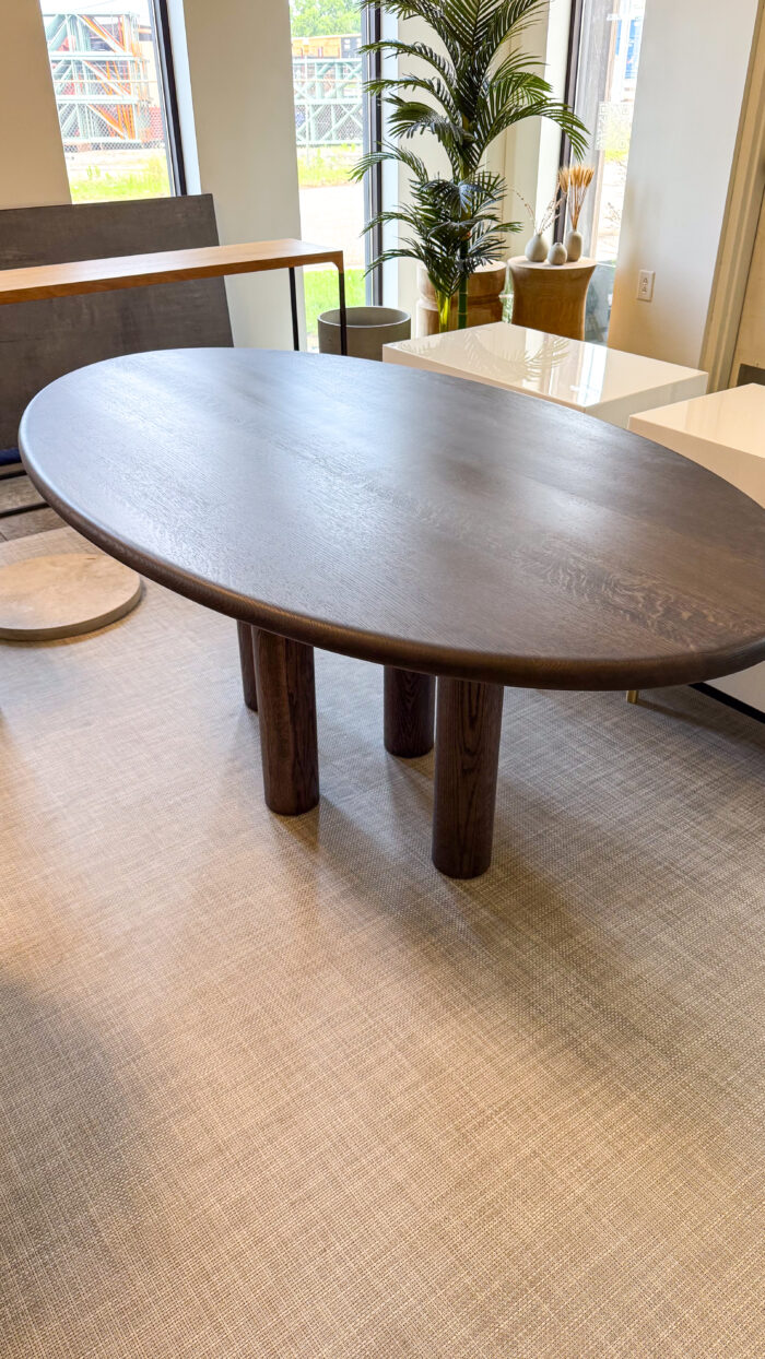 Dark Oak Oval Dining Table with Sculpted Column Legs