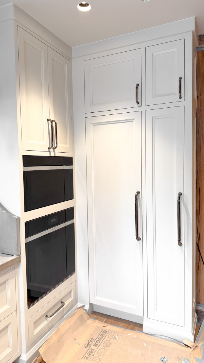 A tailored wall of storage and performance, perfectly built around integrated ovens and fridge