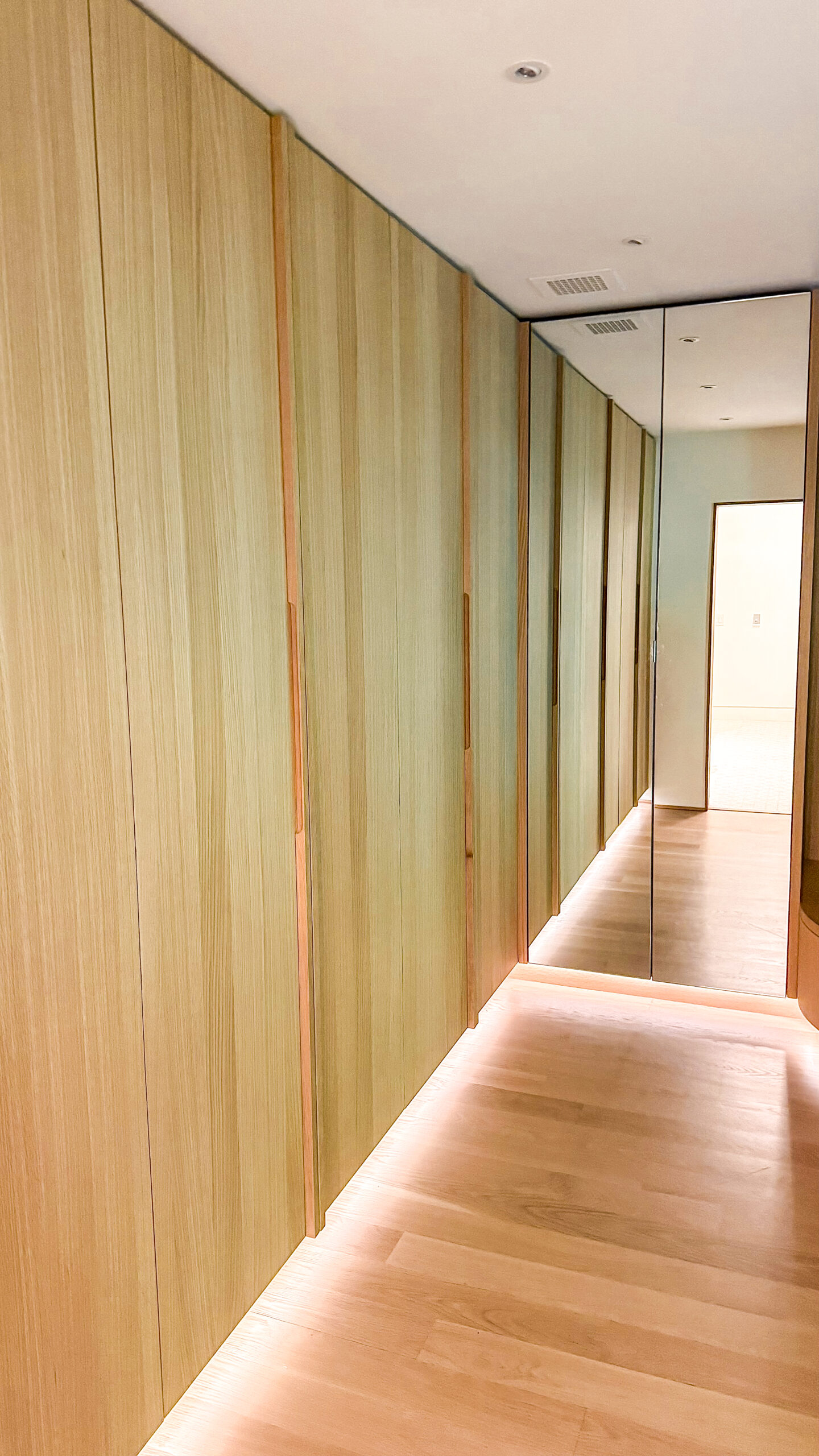 A well lit custom closet with plenty of room